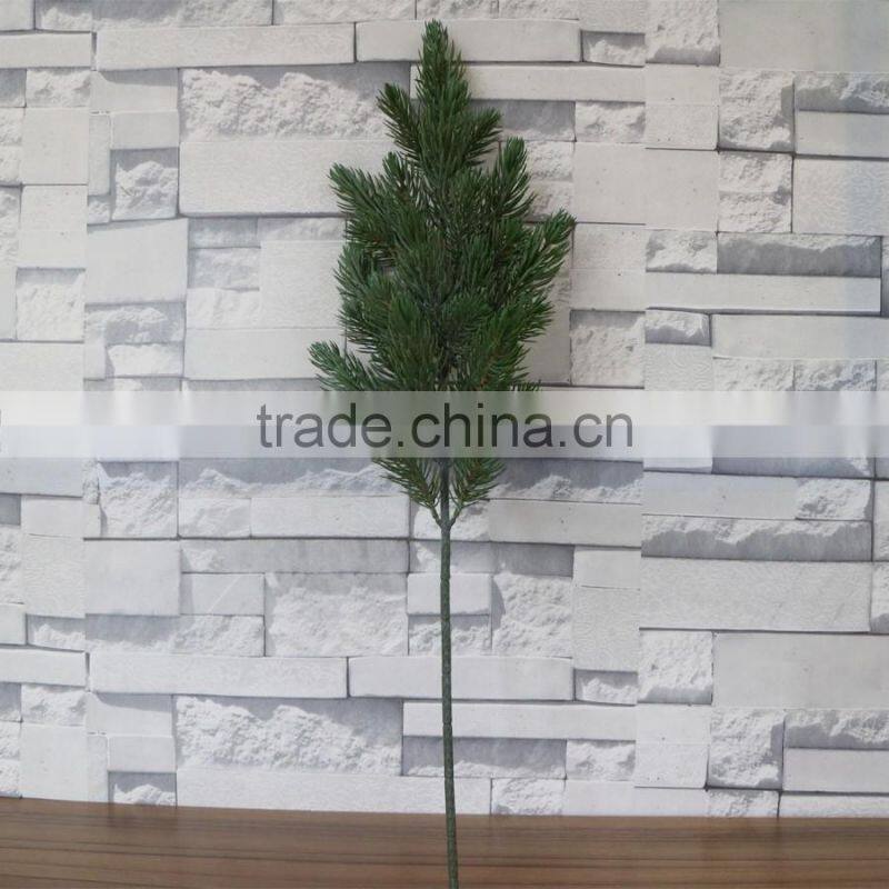 Plastic green pine tree branch