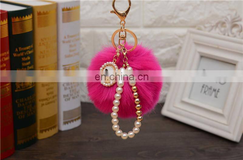 2021 Wholesale custom luxury fur ball key holder Pearl keychains pom pom bow keychain for women bag good quality