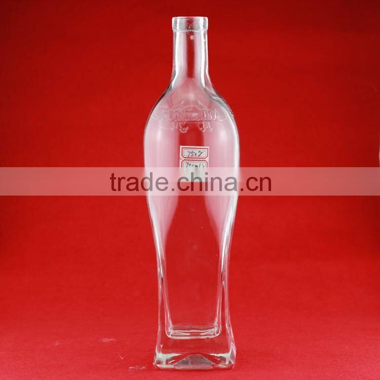 Hot selling cheap embossed spirit bottles glass vodka bottles 700ml french brandy bottle with cork
