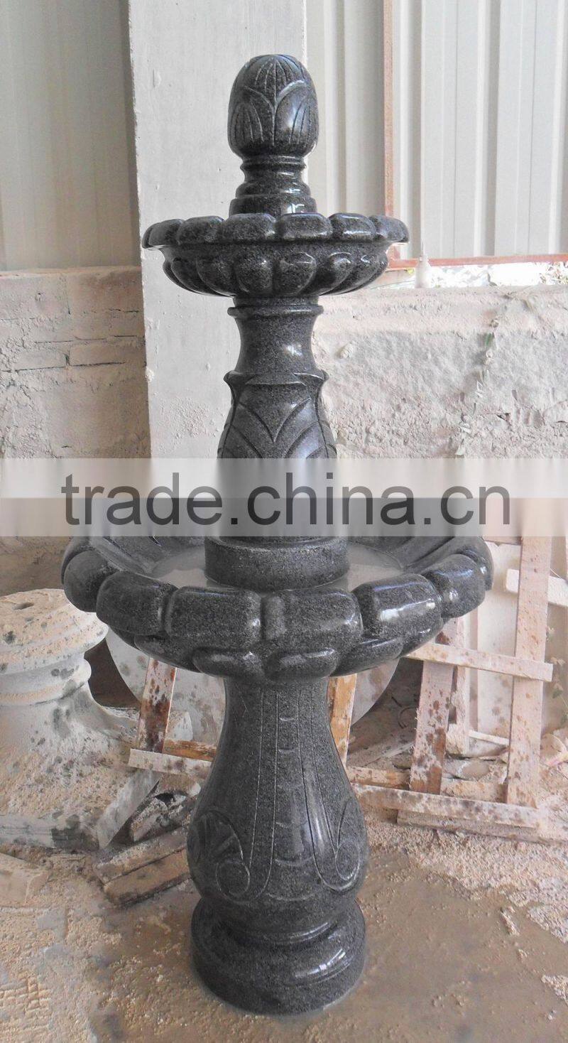 dark granite stone fountain garden