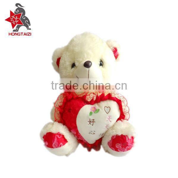 Stuffed soft plush bear with love heart