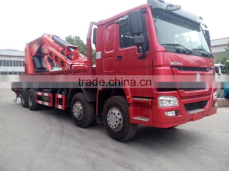 howo 8*4 70T crane truck gets up with the heavy and transport vehicle truck with loading crane