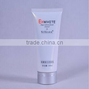 labeling collapsible empty tube with champagne aluminium cap