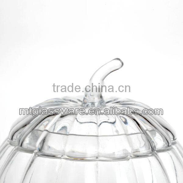 The shape of a pumpkin glass dispenser with metal stand