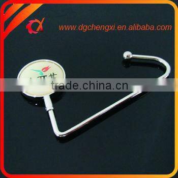 China hot sale round shape bag hanger with CX logo and metal hook