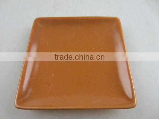 Stock glazed porcelain square sauce dish