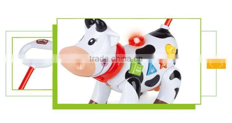 Funny hand push battery operated musical cow walking animal toys