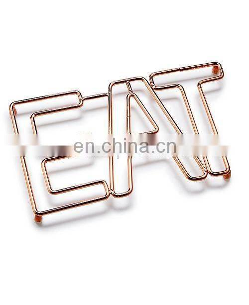 silver flower design trivet