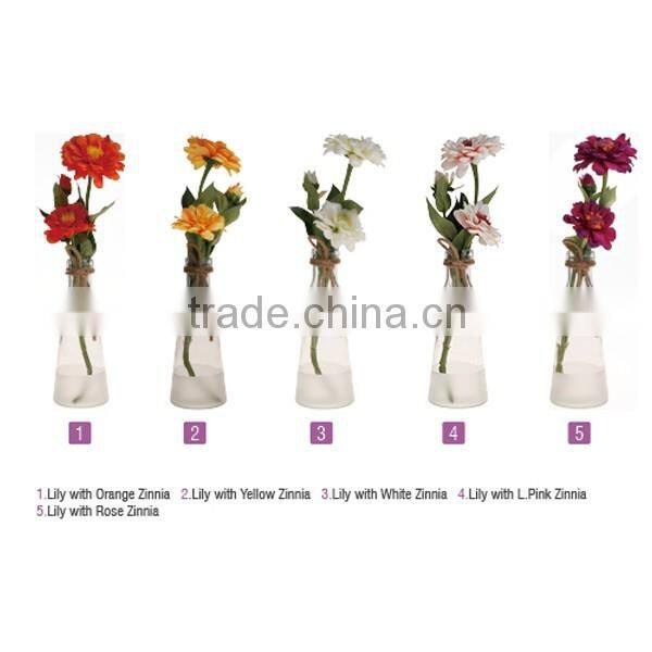 white and transparent glass vase with rope decoration and artificial flower