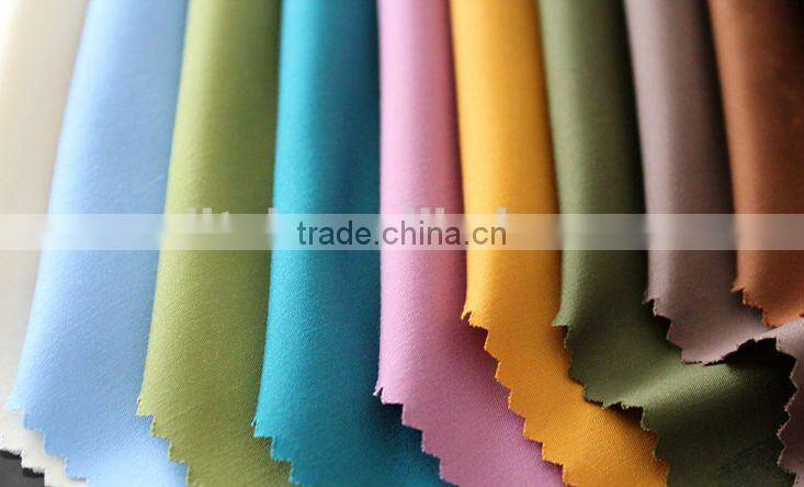 white and dyed 100% spun polyester fabric