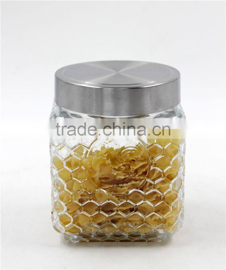 square glass canister bottle with silver lid