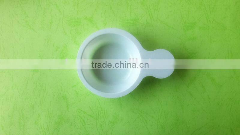 white disposable plastic tray for urine testing.