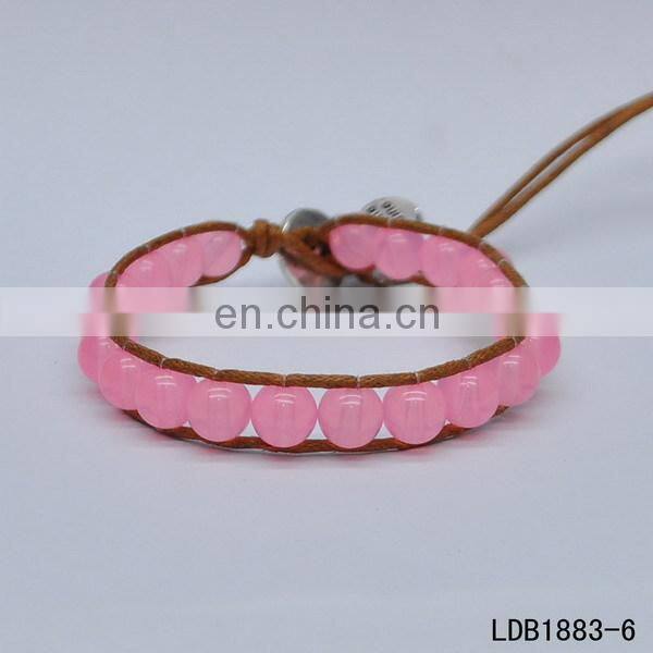 Handmade beaded wrap bracelet features 3 rows of circular and square stones surrounded by a natural colored cord on both sides