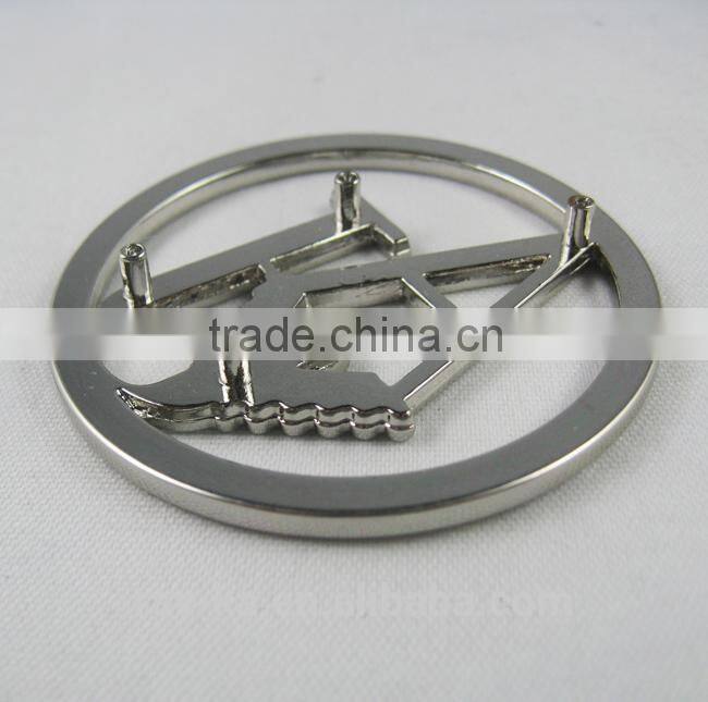 designer metal emblems handbag