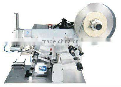 Semi-automatic bottle labeling machine