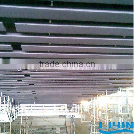 Suspended absorber acoustic ceiling panel with fiberglass