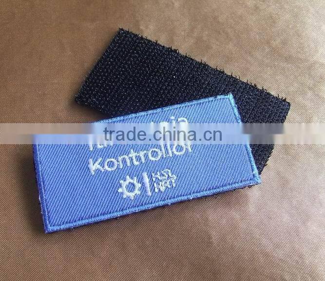factory made personalized design 100% embroidery uniform textile patches with self adhensive backside