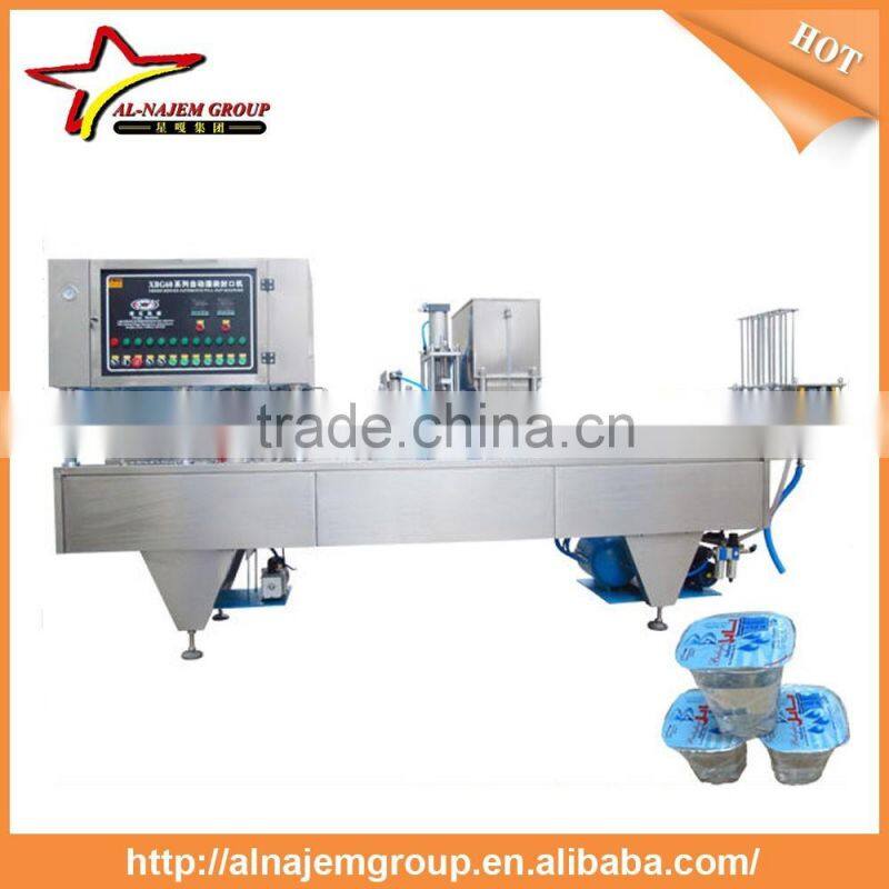 Plastic water cup filling and sealing machine/ Automatic stainless steel cup water filling machine