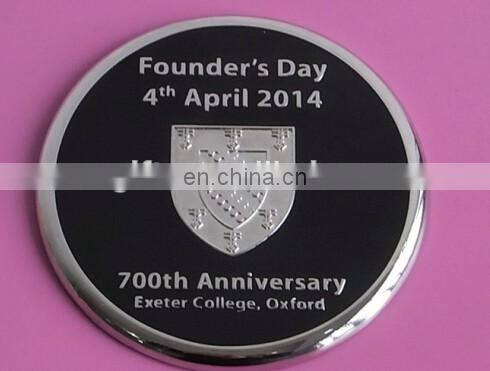 two metal coasters packed in a wood base