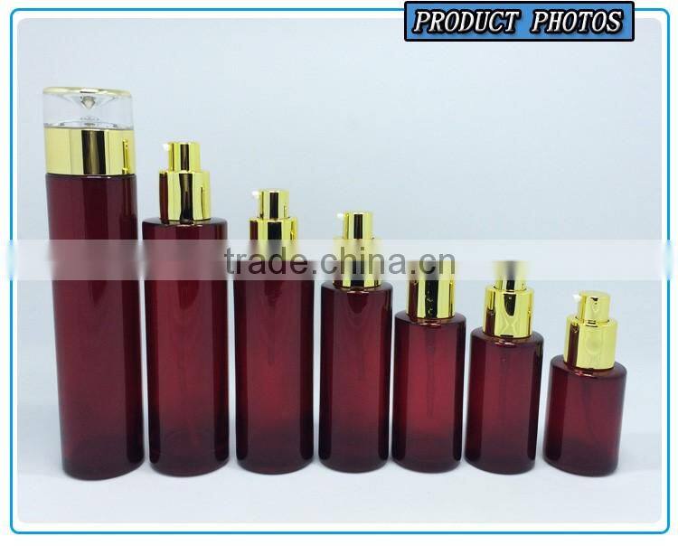 Cylinder RED coloured glass cosmetics bottles and face cream jars