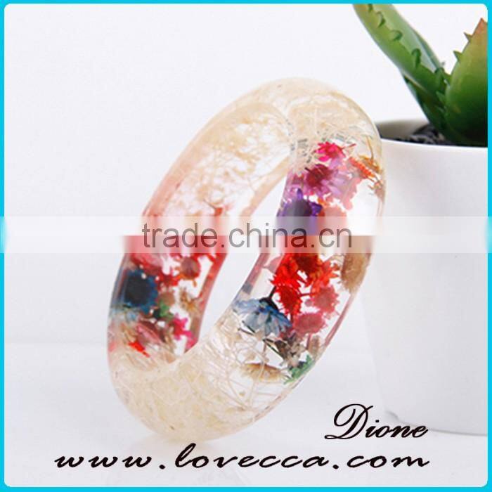 Pine needles inside transparent clear acrylic bangle stand