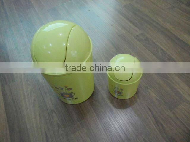 Round swing-top plastic trash can