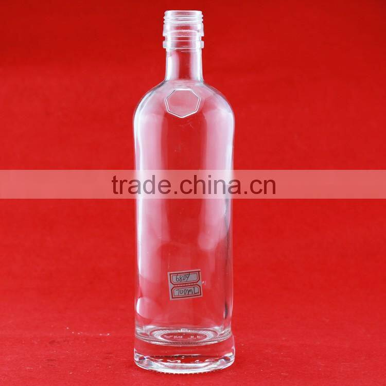 Hot selling cheap embossed spirit bottles glass vodka bottles 700ml french brandy bottle with cork