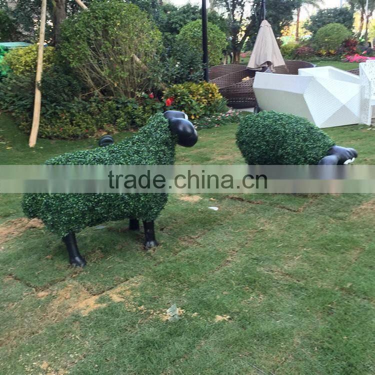 Fiberglass goat statue with artificial grass