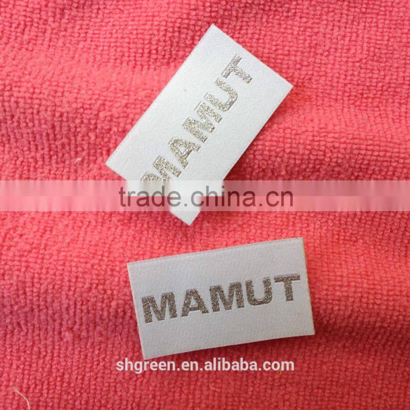soft white satin woven label with silver metallic logo