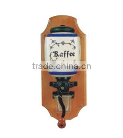 archaistic manual coffee grinder with wooden case