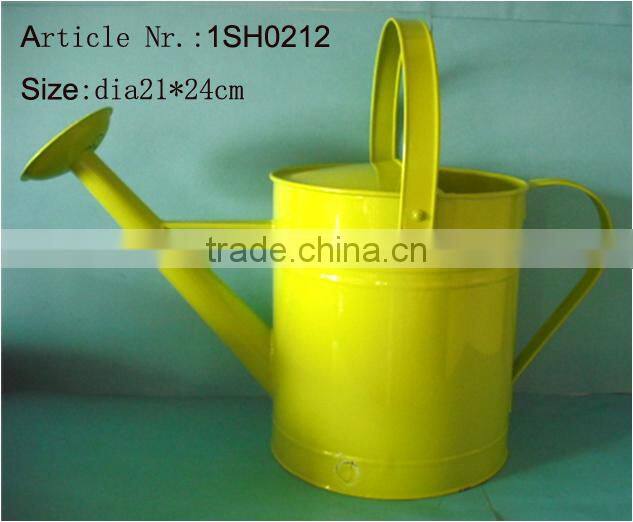 yellow decorative metal watering can