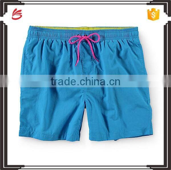 Wholesale poly plain dyed elastic shorts men beach swim men shorts