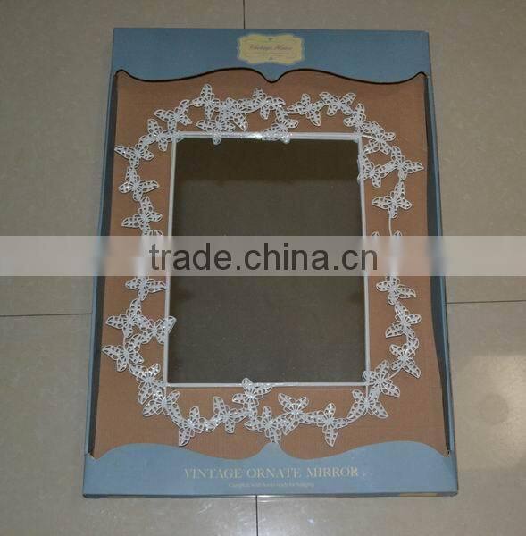 Metal wall mirror with butterfly