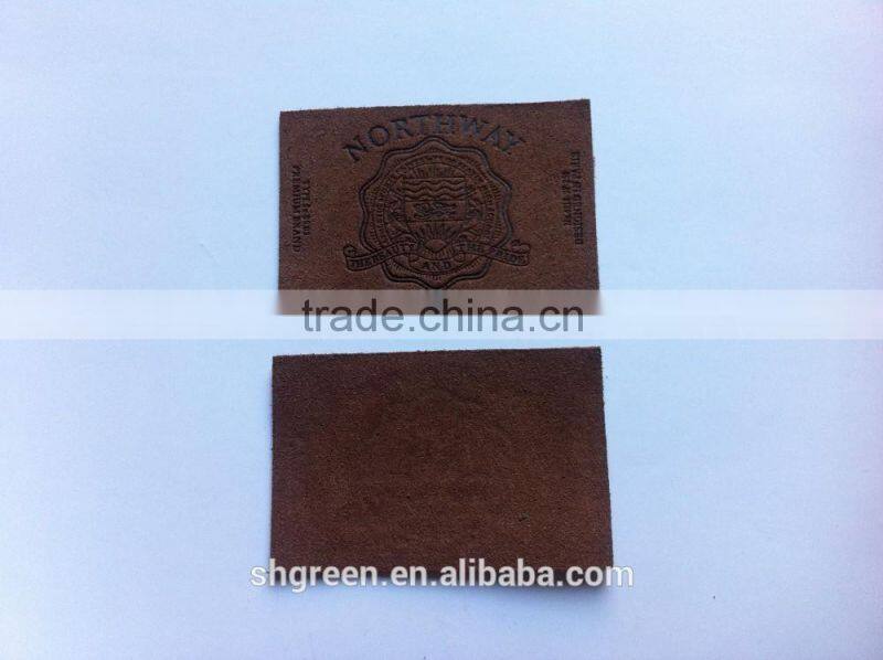 Soft debossed company name leather tags for suits