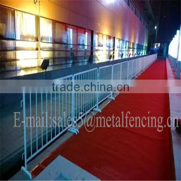 Out door orange painted crowd control for temp fence