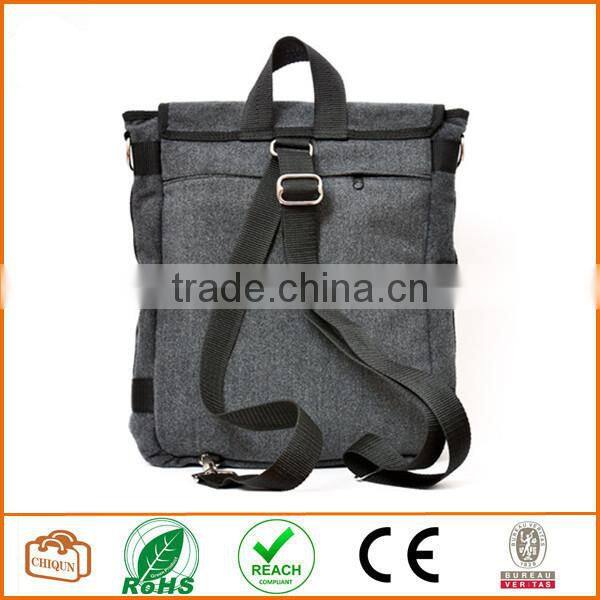 Unisex messenger bag and backpack. Grey Wool-Polyester mix with red details and lining. Multiple pockets