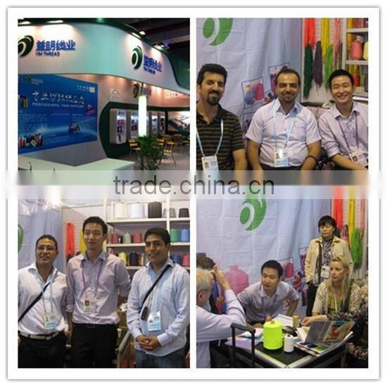 Dyed spun polyester yarn for woven tape knitting