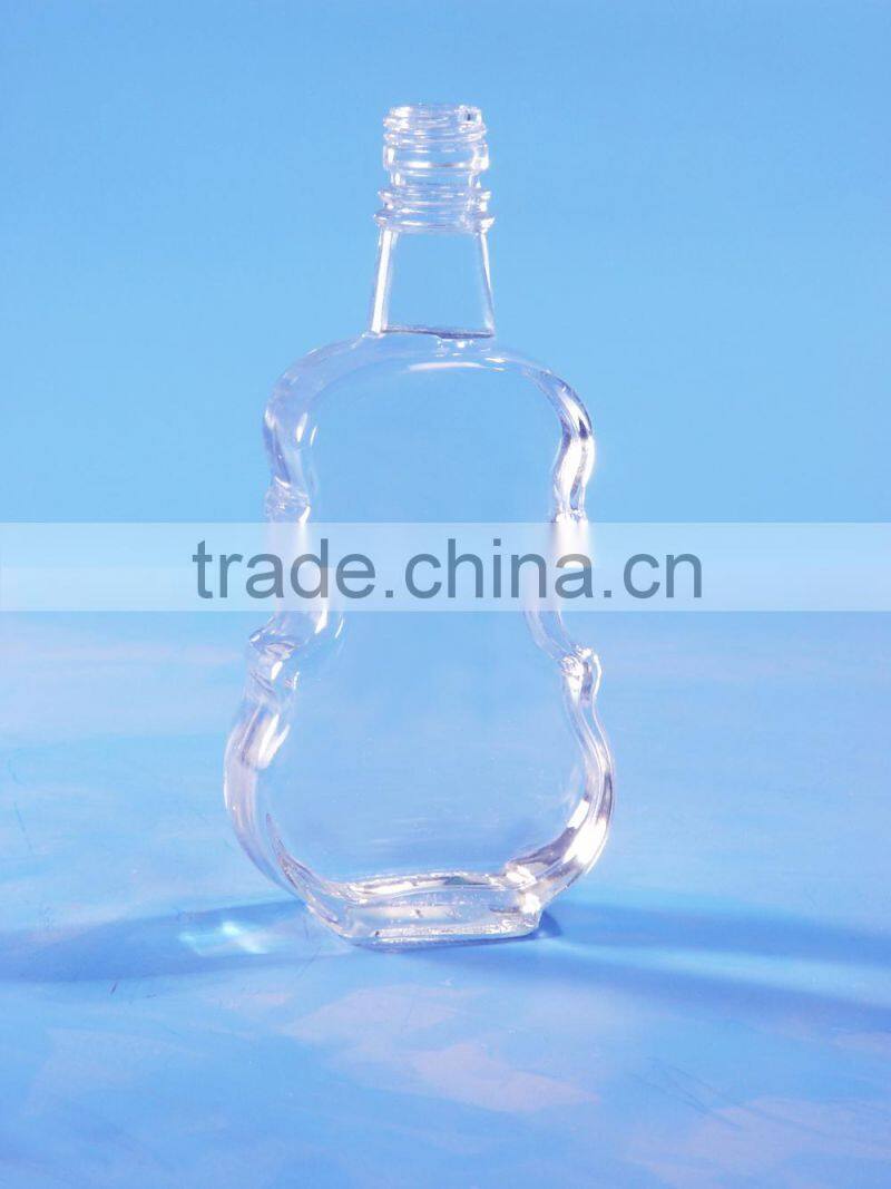 XO violin shaped glass bottle