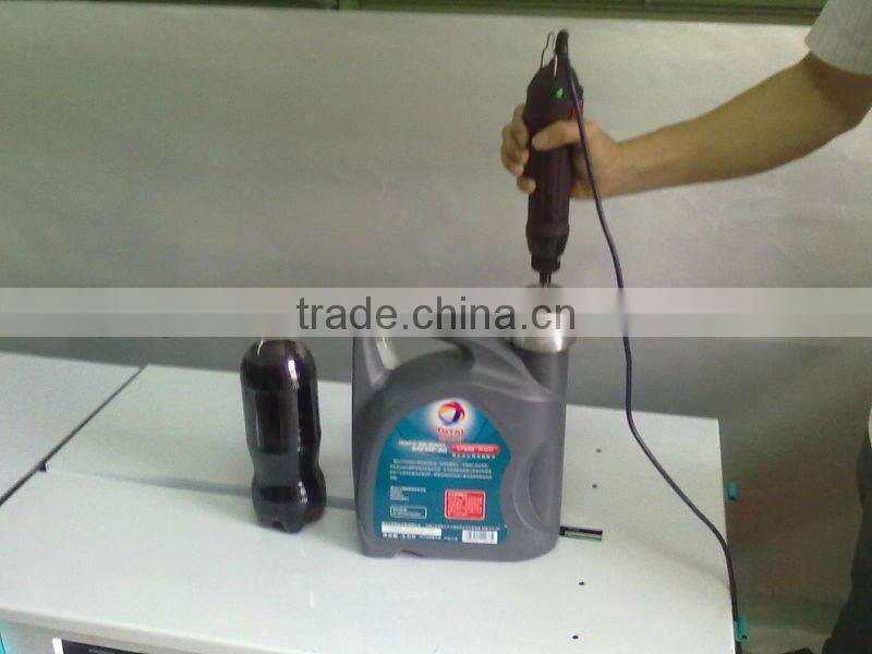 Semi-automatic spray head capping machine