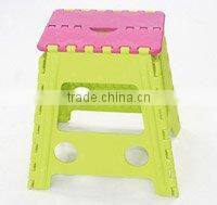 The colour of the stool is assorted folding step stool