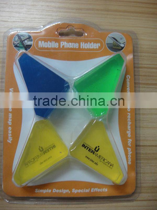 Universal dashboard cell phone holder