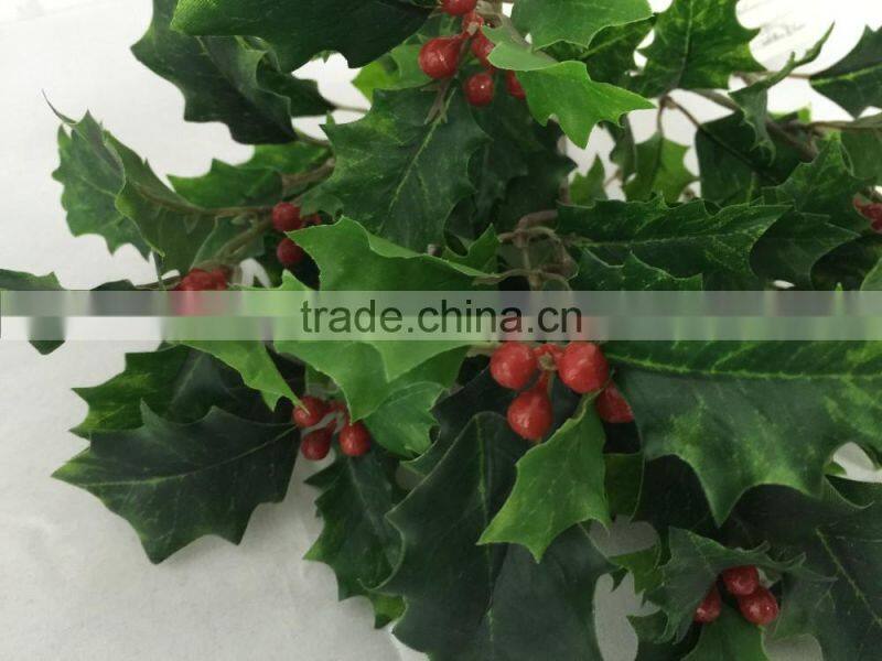 Artificial holly plant branch with red berries for xmas decoration