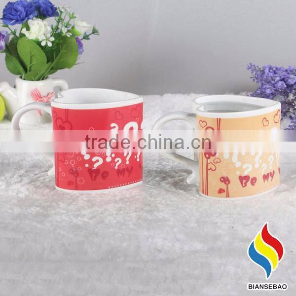 heart shape ceramic mug with revolving logo