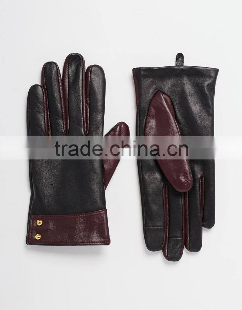 Ladies smart phone wearing leather gloves with cuff detail