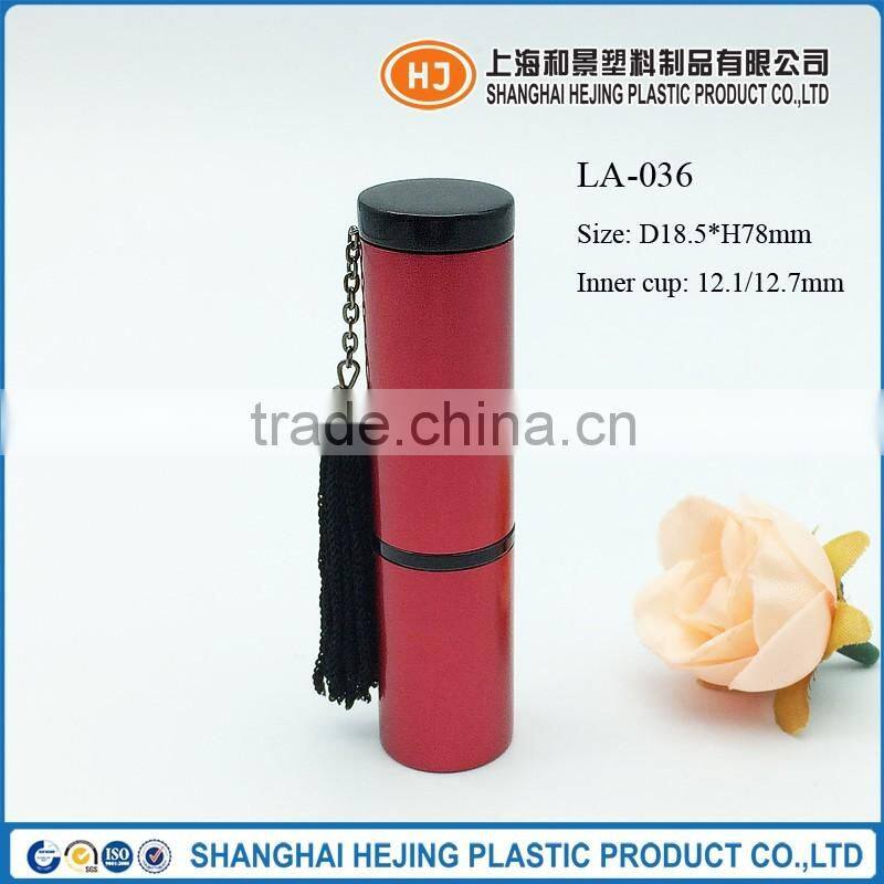 Empty red color fringed metal lipstick tube container