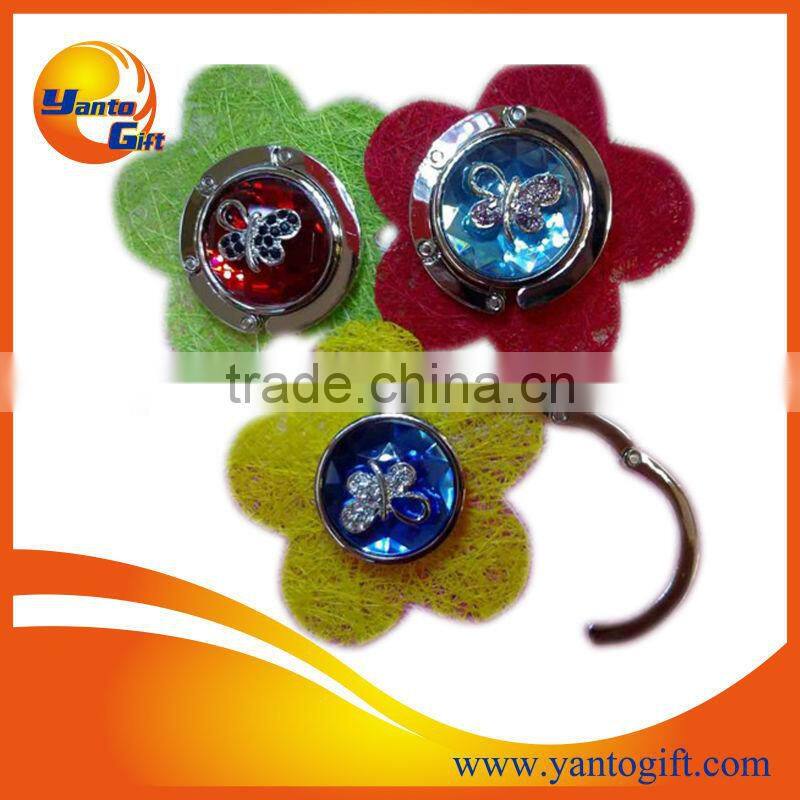 Foldable metal bag hanger