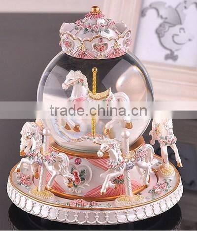 Exclusive resin carrousel rotate LED music snow globe