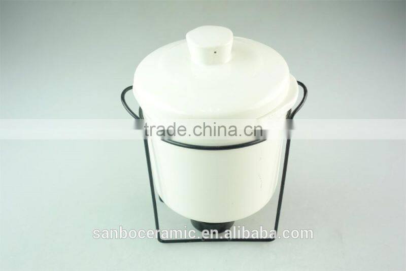White ceramic soup tureen soup bowl with iron stand in stock