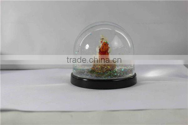 Plastic pumpkin halloween snow globe
