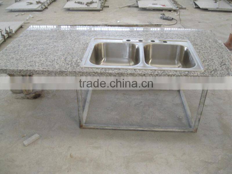 China Tiger Skin white granite kitchen countertop with upmounted sink